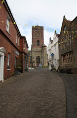 Obraz premium Lombard Street winds upward towards St Mary's Church on Church Street in Petworth, England