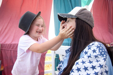 mother and daughter having fun during lunch