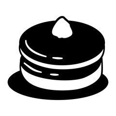 Black and white cake with a white frosting on top. The cake is sitting on a white plate