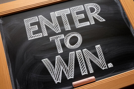 Chalkboard with wooden frame displays "Enter to Win" in textured white chalk lettering, showcasing a contest or giveaway concept