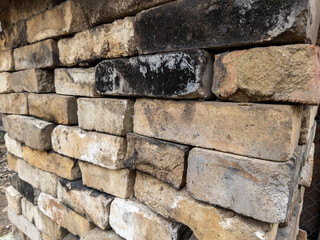 A pile of old bricks stacked on top of each other