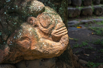 Stone tiki statue in Atuona, Hiva Oa, Marquesas Islands, French Polynesia
