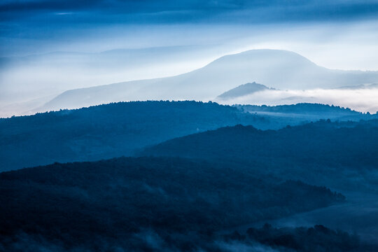 Montains in the mornig mist, blue landscape