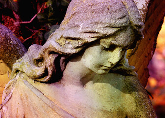 Angel as a symbol of love, kindness, and suffering. Fragment of very ancient statue.