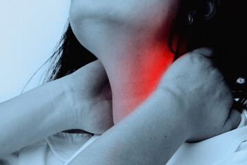Fototapeta premium Neck pain. Working at a computer and stress cause neck pain. Horizontal image.