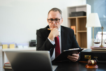 Naklejka premium Male judge in courtroom, lawyer working in office. Perfect for business, legal advice, corporate law