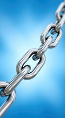 Obraz premium A shiny metal chain shows strong connection against a blue background gradient.