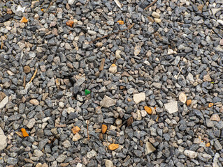 A close up of a pile of gravel on the ground