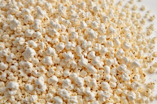A mound of fluffy popcorn kernels against a pure white backdrop , detail, leisure, photography