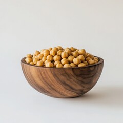 Chickpeas in a wooden bowl on a white background