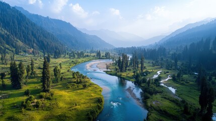Aerial view of a valley with a river flowing through it surrounded by mountains