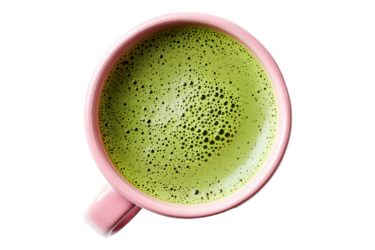 Frothy matcha green tea served in pink ceramic cup, from above isolated on white transparent background. Concept of healthy beverage