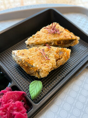 Deep-Fried Onigiri with Unagi and Microgreens. Street Food Concept. Handmade Mobile Photo, Selective Focus, Not AI