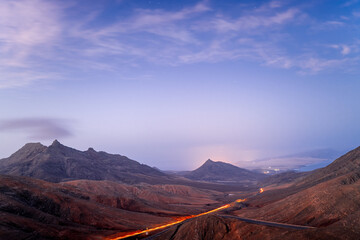 Sicasumbre mountain range viewpoints. Fuerteventura, Canary Islands, Spain. Morning high in the mountains. Long exposure of the road.	
