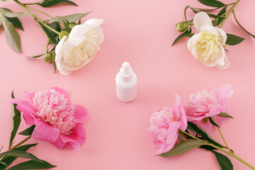 Women cosmetics with peony flowers.