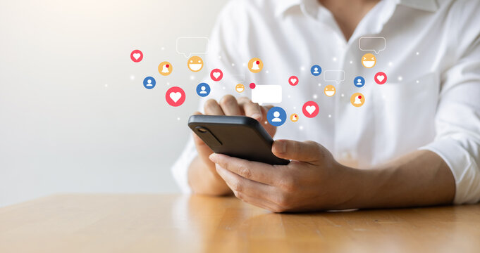 close up young man hand hold smartphone to check about social media website by reading news feed and interact  with friend for people and modern lifestyle concept