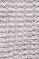 Close up of a patterned carpet with white and gray colors