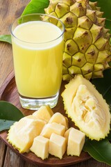 Soursop Juice Still Life Close Up on Wooden Table with Fruit and Leaves Tropical Refreshment Healthy Drink