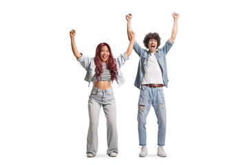 Obraz premium Happy young asian woman and caucasian guy cheering with raised arms