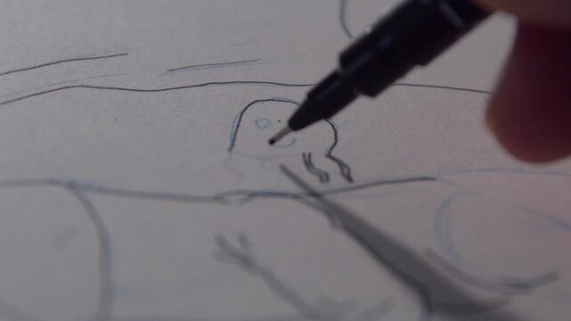 A hand drawing octopus with a pen