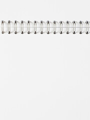 blank page of opened album with metallic spiral binder