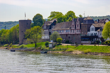 Historic cityscape of Rhens with medieval tower and half-timbered houses on the banks of the Rhine River, Germany