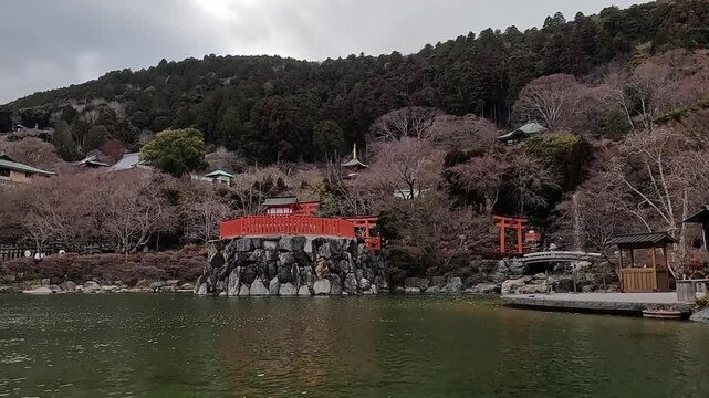 Tranquil Pond at Katsuoji Temple with View of Taho Pagoda and Benzaiten Shrine in Minoh Quasi-National Park, Osaka, Japan
