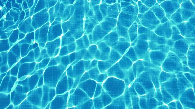 excitement on surface of blue water in swimming pool, top view, slow motion
