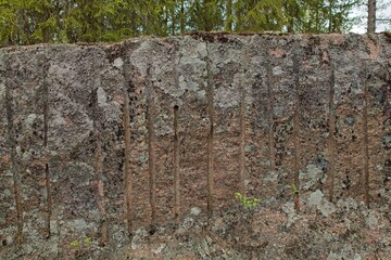 The historical Hevonniemi quarry in Pyterlahti, where red granite was excavated. Traces of excavation are still visible, Pyterlahti, Virolahti, Finland.