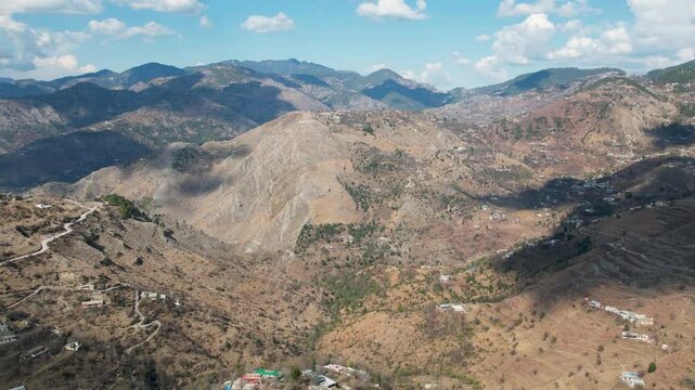 mountain range between Murree and Khyber Pakhtunkhwa with scattered hillside homes. Pakistan