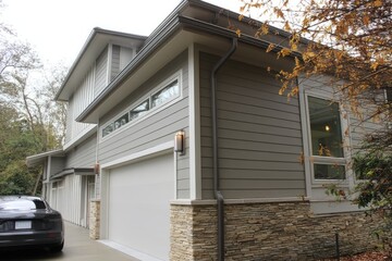 Horizontal lap siding with natural stone base and garage --ar 3:2 --v 7 Job ID: 88ec12d3-1cbb-4c2a-8cee-1e1932c4c2e1
