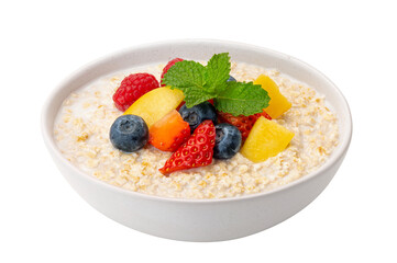 A bowl of oatmeal porridge with milk and fruits on white background. instant food.