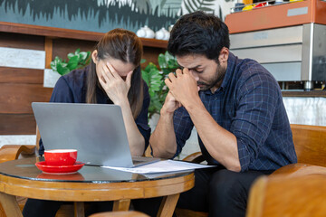 Business failed concept, coworker stressed consult with partner or husband about no profit performance calculating by laptop technology application, businessman consoling wife with love