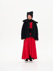 Street style fashion, Asian model in faux fur clothes on white studio background.