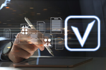Approved. Virtual screen with documents and check mark above tablet computer. Man using device at...
