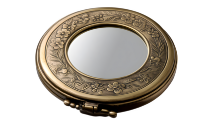 A vintage brass pocket mirror with floral engravings, symbolizing personal care and nostalgia, isolated on a transparent background