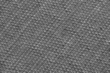 Texture of gray natural fabric with large diagonal weaving. Surface, structure of upholstery or...