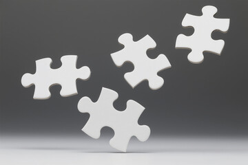 Four white puzzle pieces isolated against a gradient gray backdrop representing problem solving