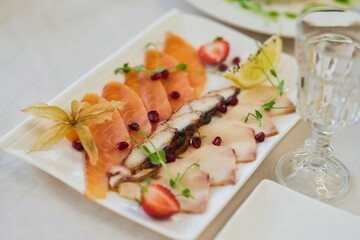 Setting the festive table. Fish slicing from various types of fish