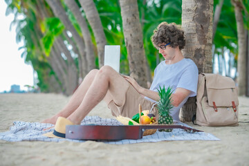 Man enjoying remote work with tropical vibes — sunshine, waves, and coconut trees. The perfect...