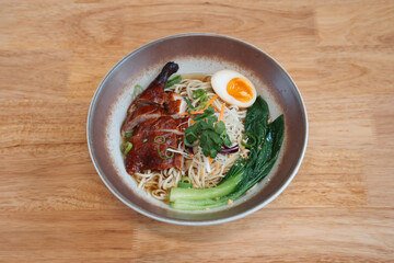 noodles with duck egg and vegetables. Delicious freshly prepared meal, perfect for menus, restaurants, or food delivery concepts.