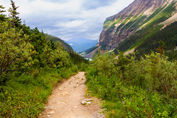 Hiking trail to Plain of Six Glaciers. Narrow path in the mountains. The Rocky Mountains. Banff National Park, Alberta, Canada