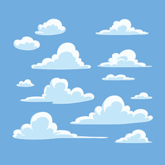 Fluffy white clouds floating in a bright blue sky.