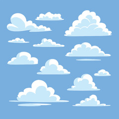 Fluffy white clouds float serenely against a clear blue sky.