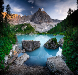 Amazing color of water on the lake Sorapis, Dolomites Alps, Italy, Europe. Lake in the evening....