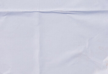 Urban-style folded and crumpled white paper, simulating an old pasted poster.