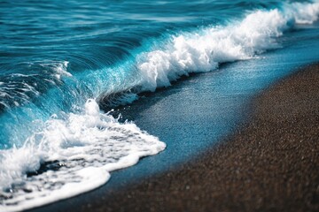 Fototapeta premium Ocean wave crashing on a sandy beach