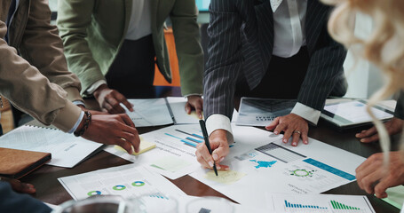 Hands, paperwork and business people in office with statistics, data or graphs for finance. Team,...