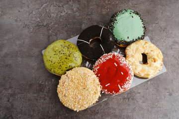 Glazed and decorated donuts, a variety of colorful donuts
