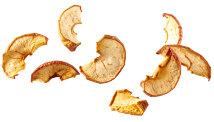 Freeze dried apple pieces floating on transparent background
